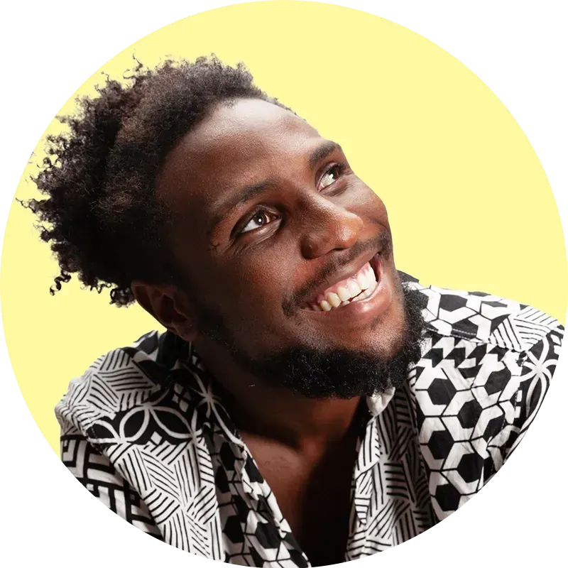 Man looking up and smiling with a yellow background